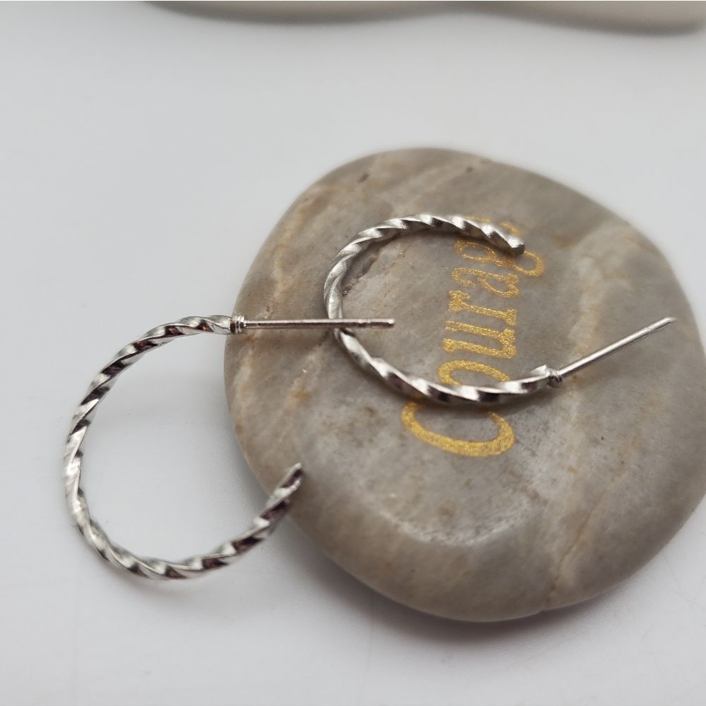 Silver tone twist hoop earrings